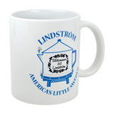 The Swedish Gift Store’s 11 oz ceramic mug features the Lindstrom Coffee Pot Water Tower and “America’s Little Sweden”—a perfect Swedish-American heritage keepsake or Chisago Lakes souvenir.