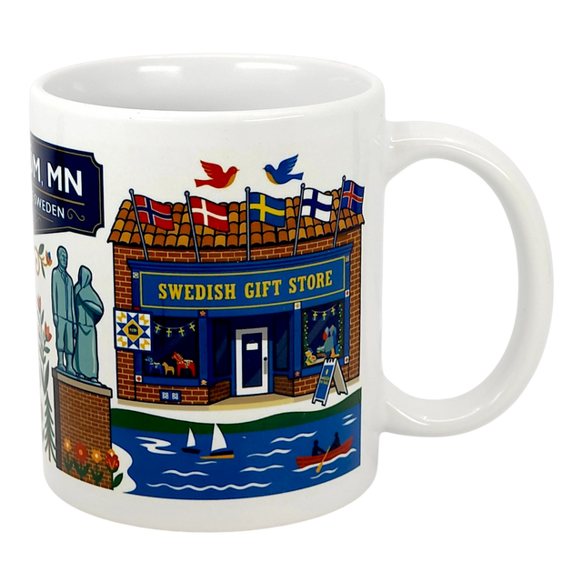 The Mug: Lindstrom, MN — America's Little Sweden 11oz ceramic souvenir mug by Swedish Gift Store features colorful illustrations of iconic Lindstrom landmarks, including flags, boats on a lake, birds, and a statue.