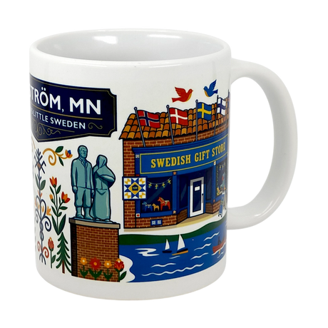The Swedish Gift Store’s 11oz ceramic mug showcases Lindstrom, MN—America’s Little Sweden—with colorful illustrations of landmarks, Swedish flags, flowers, statues, and boats. Labeled “Lindström, MN” and “Little Sweden.”.