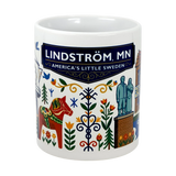 The Swedish Gift Store's 11oz Lindstrom, MN — America's Little Sweden mug features vibrant Scandinavian folk art, a Dala horse, landmarks, and "Lindström, MN" on a blue banner—an ideal ceramic souvenir or Swedish-themed gift.