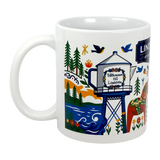 The Mug: Lindstrom, MN — America's Little Sweden | 11oz Ceramic Souvenir Mug by Swedish Gift Store features colorful Scandinavian motifs like trees, a river, birds, a red Dala horse, and "Välkommen till Lindström"—a perfect Swedish gift.