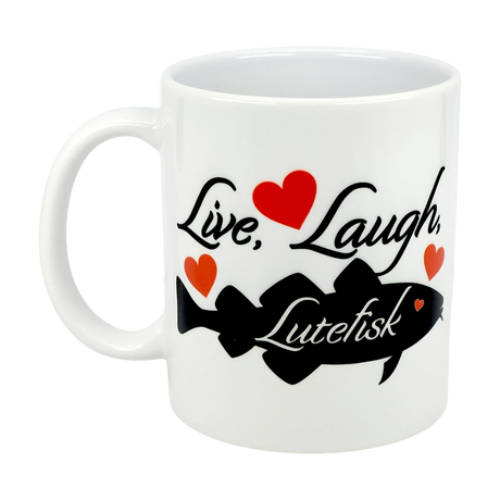 The Nordic Wholesale 11oz ceramic mug features “Live, Laugh, Lutefisk” in black text, a black fish graphic, and red hearts—a fun Scandinavian humor gift for fans of quirky traditions.