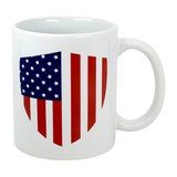 The "Mug: Made in America with American Parts Ceramic Mug (11 oz)" by Swedish Gift Store features a patriotic shield-shaped American flag design with blue and white stars on the upper left and red vertical stripes.
