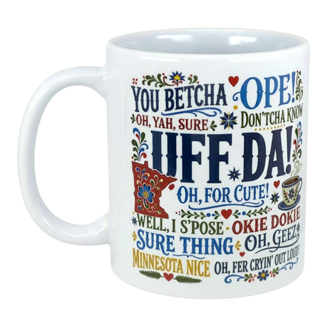 White mug featuring colorful regional sayings such as UFF DA!, YOU BETCHA, and OKIE DOKIE, surrounded by small floral decorations.