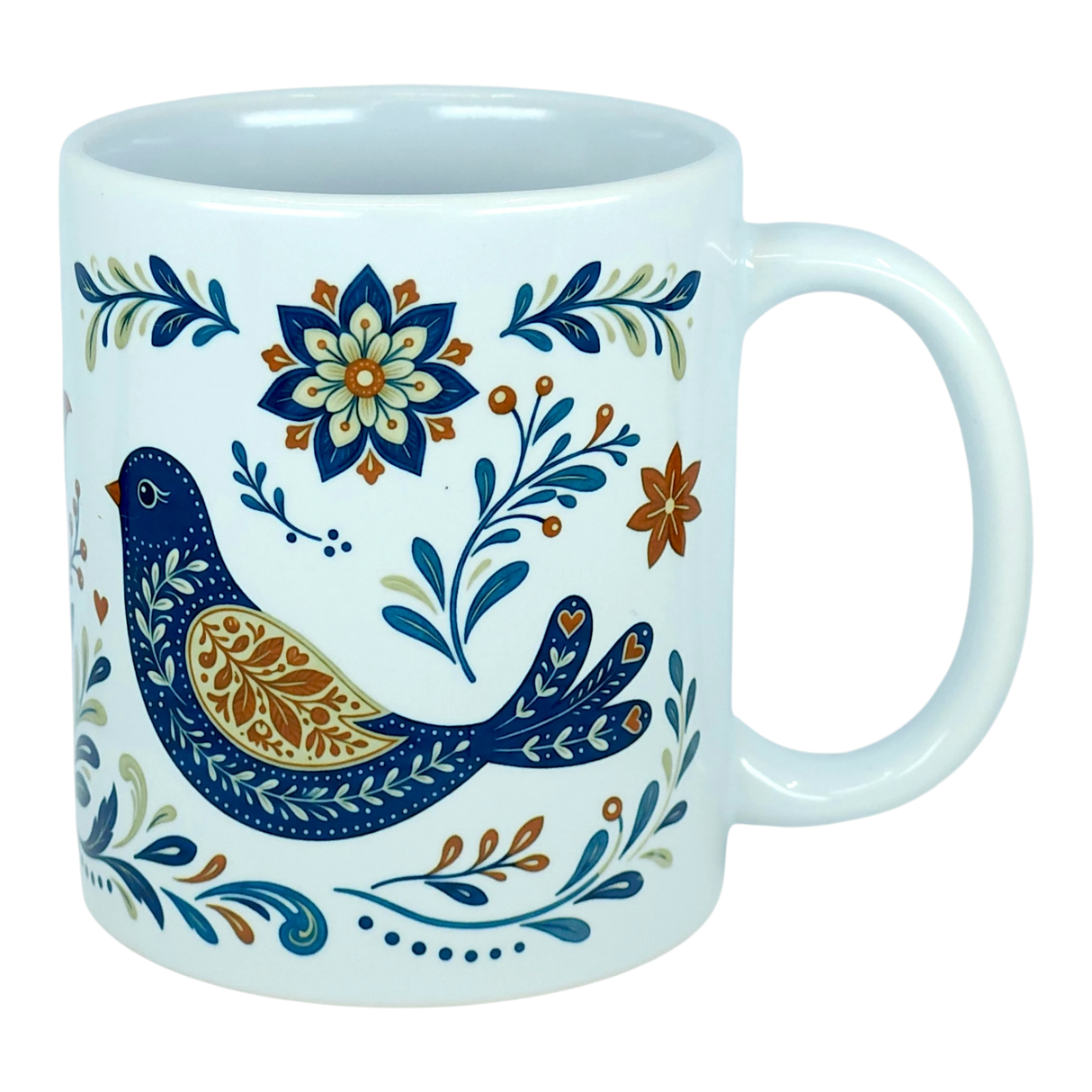 The Nordic Wholesale Mug: Nordic Folk Art Birds Ceramic Mug (11 oz Capacity) is a white Scandinavian-style ceramic mug showcasing a decorative blue bird encircled by detailed floral motifs in blue, orange, and gold hues. It features a plain background and a large handle.
