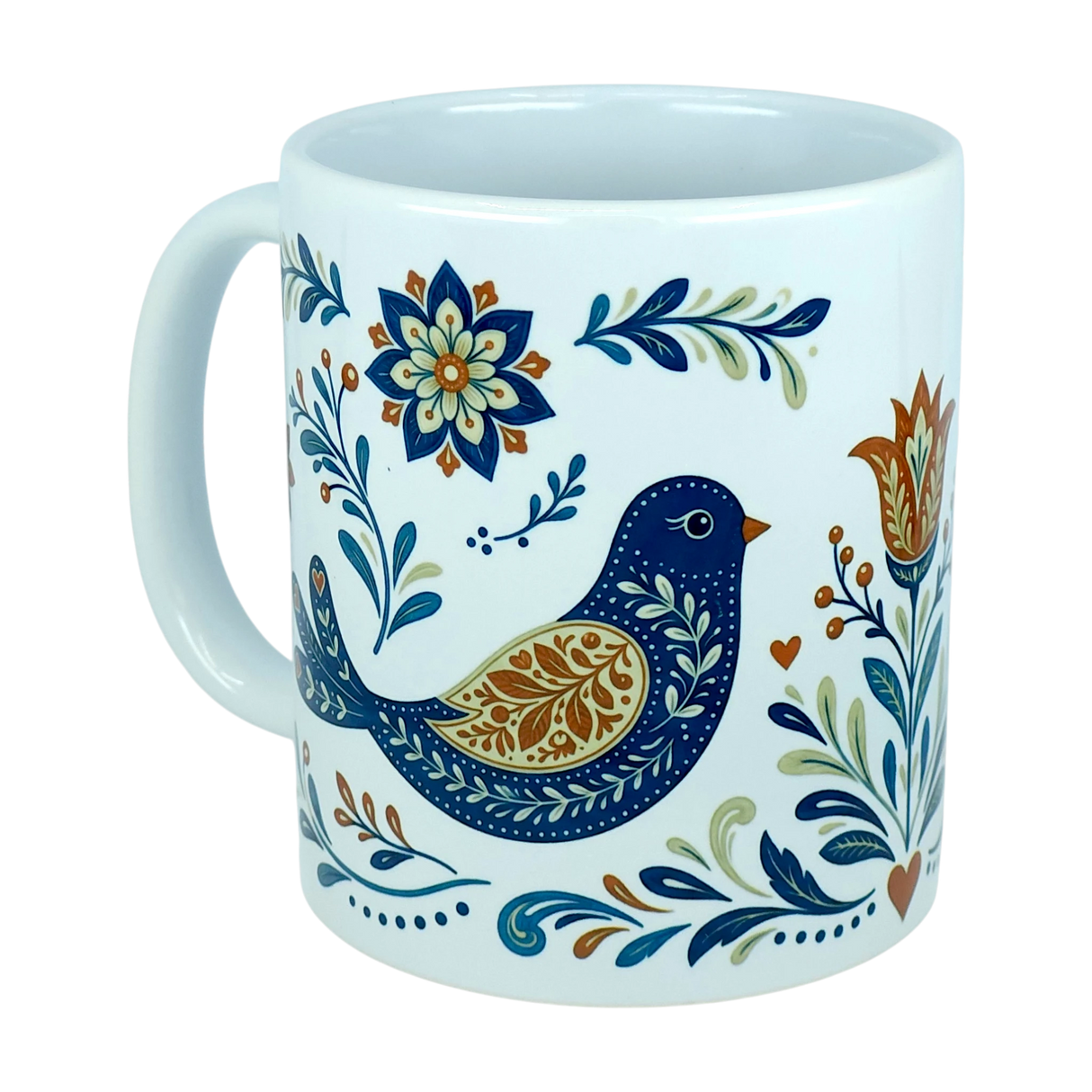 The Nordic Wholesale Mug: Nordic Folk Art Birds Ceramic Mug (11 oz Capacity) is a white ceramic mug with a handle, decorated with a blue and gold folk art bird surrounded by floral and leafy patterns in shades of blue, green, gold, and orange—bringing the charm of Scandinavian design inspired by traditional Nordic rosemaling to your drinkware collection.