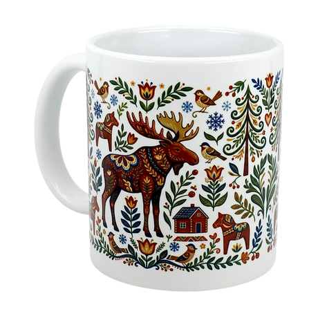 The Mug: Nordic Forest Kurbits Dala Moose Wraparound Ceramic Mug (11 oz) by Swedish Gift Store features a vibrant folk-art moose, birds, trees, flowers, house, and snowflakes in red, blue, green, and yellow on a white background.