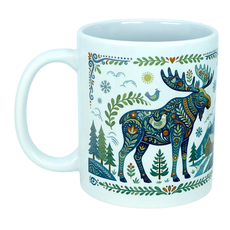 The Mug: Nordic Forest Moose Ceramic Mug (11 oz) by Nordic Wholesale showcases a vibrant, ornate illustration of a moose adorned with patterned designs, surrounded by trees, a small house, the sun, birds, and decorative foliage on a crisp white ceramic background. Inspired by Nordic folk art mug motifs, this charming Scandinavian piece adds whimsical beauty to your coffee routine.
