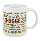 The Nordic Hygge Comfort Typography Ceramic Mug (11 oz) by Swedish Gift Store features “Hygge” with cozy icons—candles, tea, books, socks, blankets—and words like warmth and comfort. A Scandinavian mug perfect for relaxation and well-being.