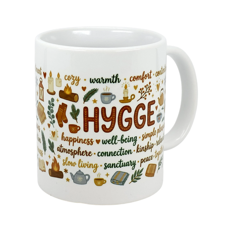 The Nordic Hygge Comfort Typography Ceramic Mug (11 oz) by Swedish Gift Store features "Hygge" in bold with cozy words and illustrations—a perfect Scandinavian mug to enjoy relaxing moments.