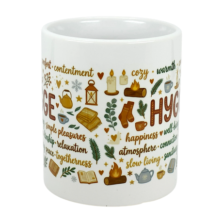 Sip in style with the Nordic Hygge Comfort Typography Ceramic Mug (11 oz) by Swedish Gift Store, featuring HYGGE, cozy icons—books, socks, candles, tea—and words like comfort and warmth for a perfect Scandinavian coffee cup vibe.