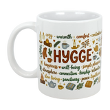 The Mug: Nordic Hygge Comfort Typography Ceramic Mug (11 oz) by Swedish Gift Store features "HYGGE" and cozy icons like candles, books, and teacups—a perfect nordic mug for warmth, comfort, and well-being.