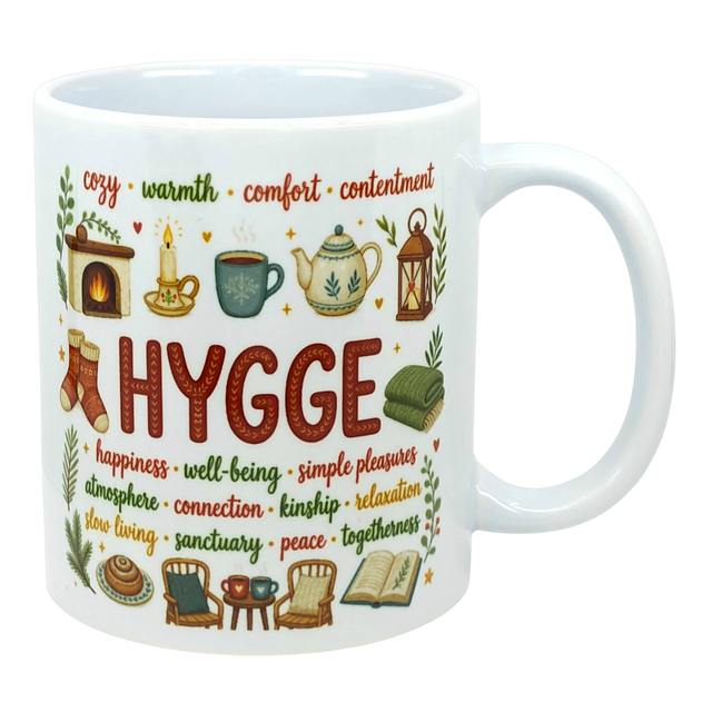 Ceramic coffee cup with the word “HYGGE” and Scandinavian-style illustrations of a fireplace, socks, teapot, chair, and book.