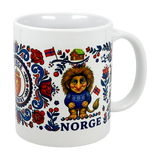 The 11 oz ceramic "Norge Norway Rosemaling Troll Wraparound Mug" by Nordic Wholesalers features Norwegian folk art, a troll in a blue sweater, flags, a wooden house, red flowers, and "Norge"—a charming Norway folklore gift.