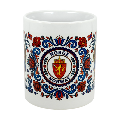The Swedish Gift Store's 11 oz ceramic Mug: Norge Norway Rosemaling Troll features wraparound red, blue, and gold Norwegian folk art with trolls and small flags—a perfect collectible or folklore gift.