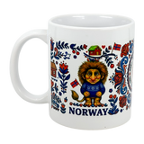 The Mug: Norge Norway Rosemaling Troll Wraparound Ceramic Mug (11 oz) by Nordic Wholesalers features folk art, a cute troll in a blue sweater, red flowers, flags, and bold NORWAY text—a perfect Norwegian souvenir or coffee cup.