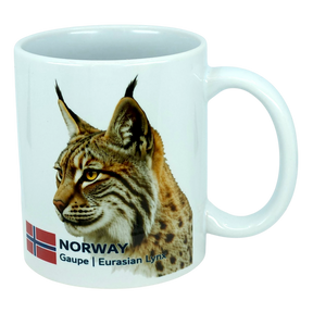 Enjoy your favorite beverage with the Mug: Norway National Animal Eurasian Lynx Ceramic Mug (11 oz) by Nordic Wholesale. This white ceramic mug features a detailed illustration of the Eurasian lynx, complete with tufted ears and a spotted coat, alongside the Norwegian flag and the text “NORWAY Gaupe | Eurasian Lynx." An ideal tribute to Norway's natural heritage, this mug is perfect for anyone who loves Norwegian wildlife.