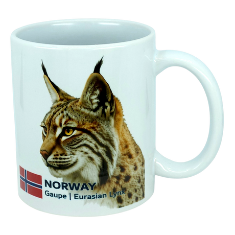 Enjoy your favorite beverage with the Mug: Norway National Animal Eurasian Lynx Ceramic Mug (11 oz) by Nordic Wholesale. This white ceramic mug features a detailed illustration of the Eurasian lynx, complete with tufted ears and a spotted coat, alongside the Norwegian flag and the text “NORWAY Gaupe | Eurasian Lynx." An ideal tribute to Norway's natural heritage, this mug is perfect for anyone who loves Norwegian wildlife.