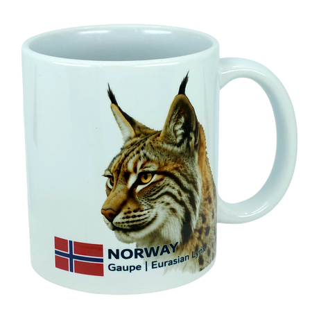 The Mug: Norway National Animal Eurasian Lynx Ceramic Mug (11 oz) by Nordic Wholesale is a white mug featuring the head of a Eurasian lynx, the Norwegian flag, and the text "NORWAY Gaupe | Eurasian Lynx"—a unique ceramic mug celebrating Norwegian wildlife and Nordic culture.