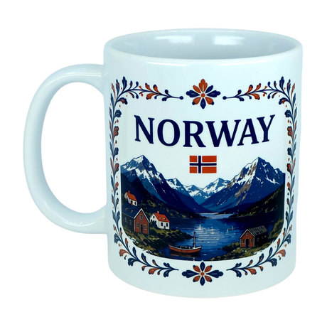 Experience the essence of Norwegian heritage with the Mug: Norway Fjord Mountain Ceramic Mug (11 oz Capacity) by Nordic Wholesale. This beautiful white mug features the word "NORWAY," a Norwegian flag, and a vibrant illustration of mountains, water, boats, and houses—all surrounded by an elegant floral rosemaling border. A striking tribute to traditional artistry, this fjord ceramic mug is perfect for anyone who appreciates authentic Nordic design.
