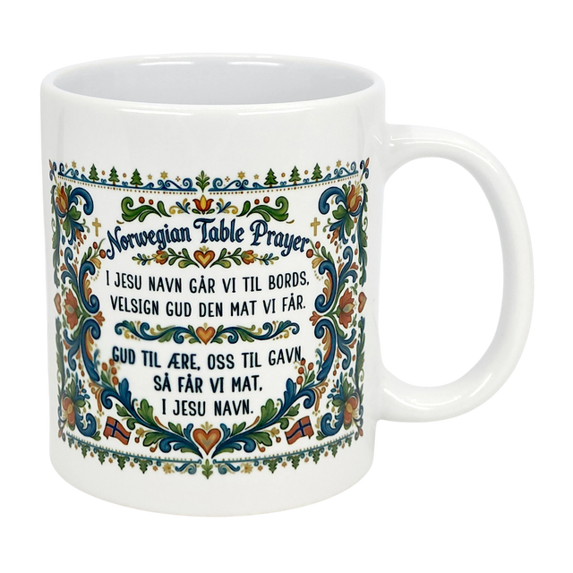 The Nordic Wholesale Mug: Norwegian Table Prayer Ceramic Rosemaling Mug (11 oz) features colorful floral patterns and the Norwegian Table Prayer in both Norwegian and English—an ideal gift for celebrating Norwegian heritage.