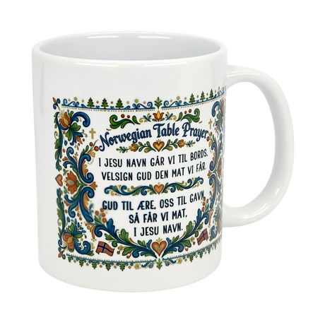 The Nordic Wholesale Mug: Norwegian Table Prayer Ceramic Rosemaling Mug (11 oz) features colorful floral patterns, Norwegian flags, and the Table Prayer in Norwegian—an ideal gift celebrating unique Norwegian heritage.