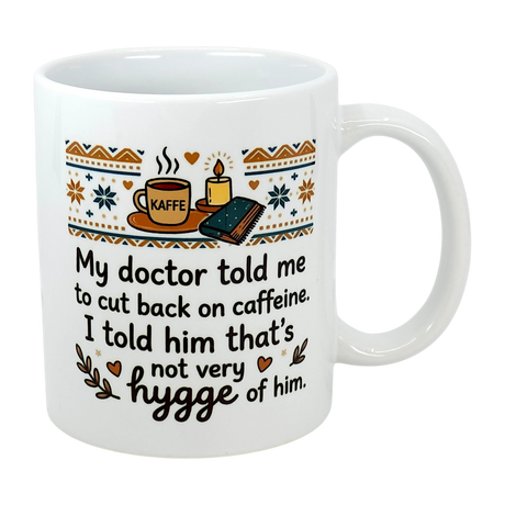 The Swedish Gift Store's 11 oz "Not Very Hygge" Coffee Mug features Nordic patterns and text: My doctor told me to cut back on caffeine. I told him that's not very Scandinavian humor—or hygge coffee mug—of him.