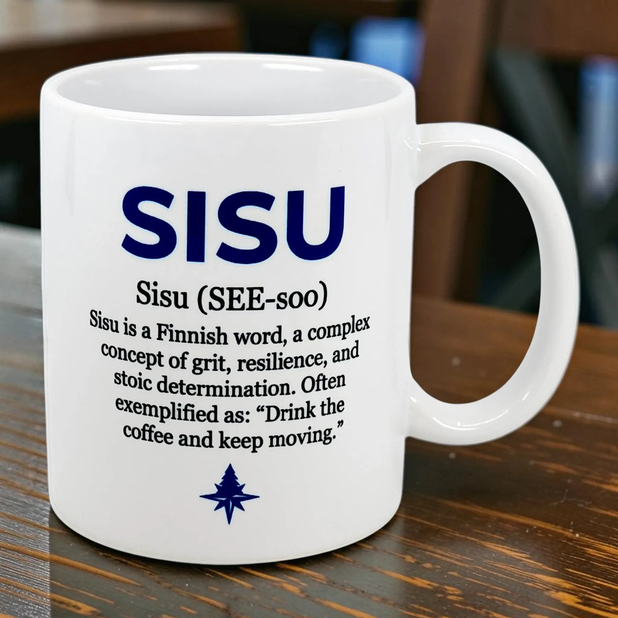 The Nordic Wholesalers 11 oz ceramic mug features blue “sisu”—Finnish for grit, resilience, and determination—pronounced “SEE-soo,” with the example: “Drink the coffee and keep moving.”.