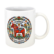 The "Sverige Dala Häst" Mug by Swedish Gift Store features a red Dala horse framed by a Swedish folk art wreath, with “Sverige” and “Dalahäst” stylishly displayed above and below the design. 11 oz ceramic.