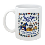 The Swedish Gift Store’s 11 oz Mug: Swedish Fika Cozy Tradition Blue Dala Horse features Scandinavian folk art, vibrant Dala horse, coffee, cinnamon rolls, cake illustrations, and festive text celebrating Sweden’s fika ritual.