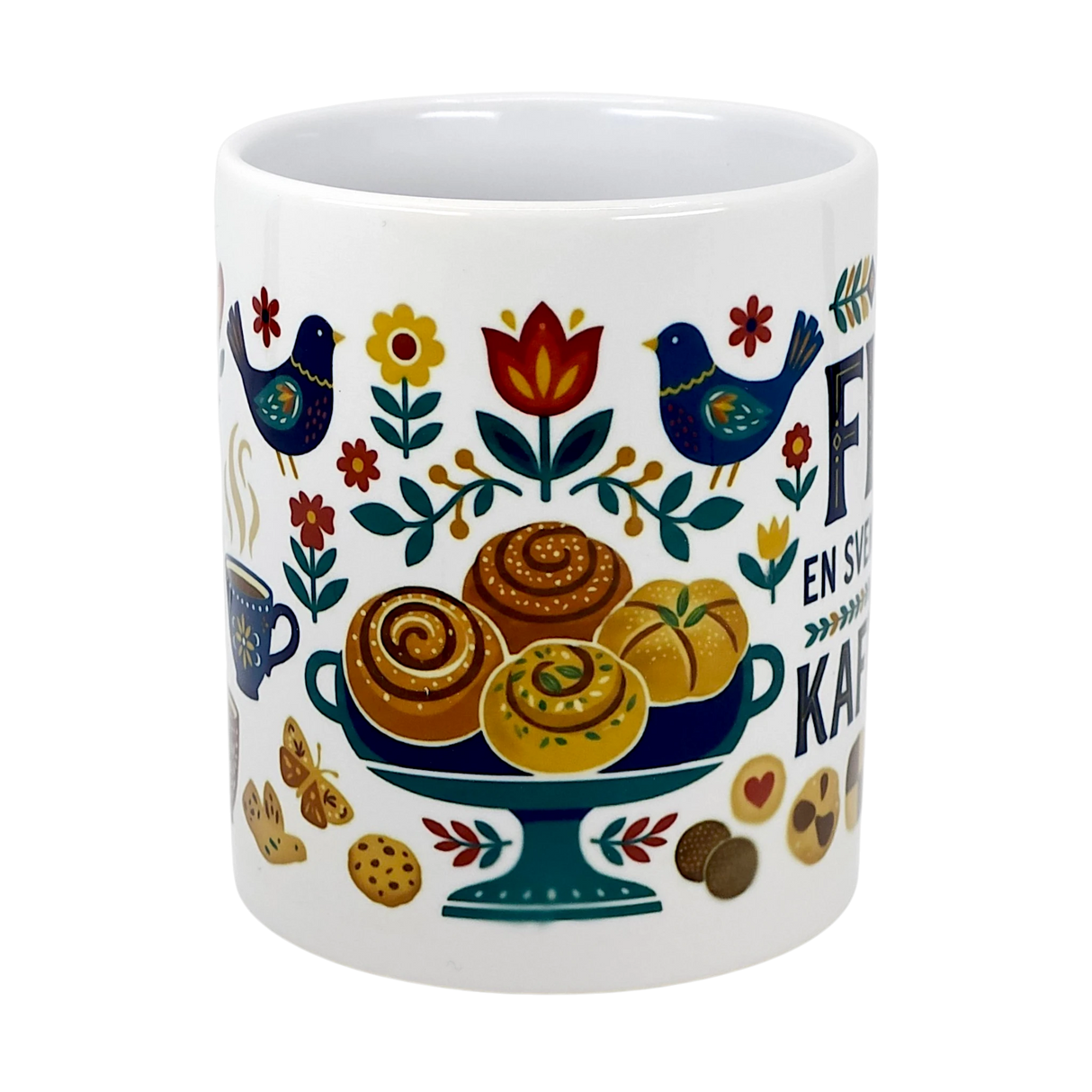The Swedish Gift Store’s 11 oz ceramic "Swedish Fika Traditions" mug features colorful folk art—blue birds, flowers, pastries, cookies, a steaming cup—and Spanish text.