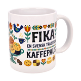 The Nordic Wholesale Mug: Fika—"En Svensk Tradition Kaffepaus" 11 oz ceramic mug features Nordic pastries, flowers, a blue bird, and Swedish fika tradition text—an ideal gift for coffee and fika lovers.