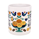 The Nordic Wholesale "En Svensk Tradition Kaffepaus" 11 oz ceramic mug features a vibrant wraparound Fika design with birds, flowers, pastries, and coffee—celebrating Swedish traditions and Scandinavian folk art. A unique gift for Fika lovers.
