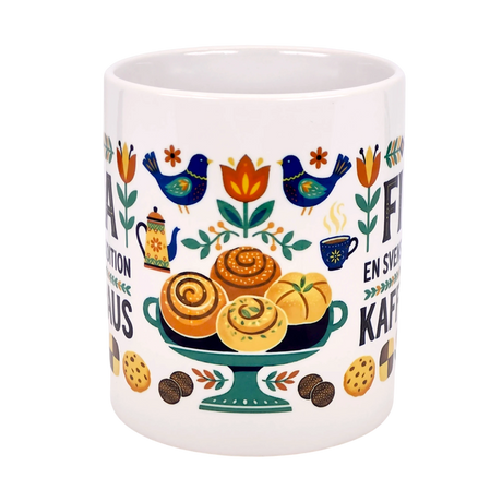 The Nordic Wholesale "En Svensk Tradition Kaffepaus" 11 oz ceramic mug features a vibrant wraparound Fika design with birds, flowers, pastries, and coffee—celebrating Swedish traditions and Scandinavian folk art. A unique gift for Fika lovers.