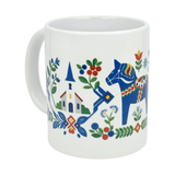 Enjoy your favorite beverage in the Mug: Swedish Folk Art — Blue Dala Horse, Church & Red House | 11oz Ceramic Mug from Nordic Wholesale. This white ceramic mug features a vibrant Scandinavian folk art design with a blue Dala horse, colorful flowers, leafy motifs, a church with a steeple, and a charming red house. Accented in bold red, green, yellow, and blue hues for an authentic Swedish style.