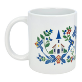 The Mug: Swedish Folk Art — Blue Dala Horse, Church & Red House by Nordic Wholesale is an 11oz white ceramic mug featuring a vibrant Scandinavian folk art design. The artwork beautifully showcases a blue church steeple, blue Dala horse, red house, and stylized flowers and leaves in blue, green, red, and yellow—capturing the spirit of traditional Swedish craftsmanship in every detail.
