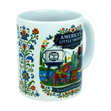 Nordic Wholesale’s “America’s Little Sweden” ceramic mug (11 oz) from Swedish Gift Store features vibrant Swedish folk art, including Lindstrom, Minnesota landmarks and iconic Dala horse imagery. The charming white mug also displays the website SwedishGiftStore.com.