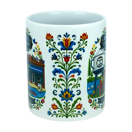 Experience the charm of Swedish-American heritage with the Mug: Swedish Gift Store America's Little Sweden Ceramic Mug (11 oz) by Nordic Wholesale, featuring colorful, symmetrical floral designs and partial illustrations of iconic buildings and signs inspired by a Swedish gift store. This white ceramic mug is thoughtfully adorned to celebrate every detail of "America's Little Sweden.