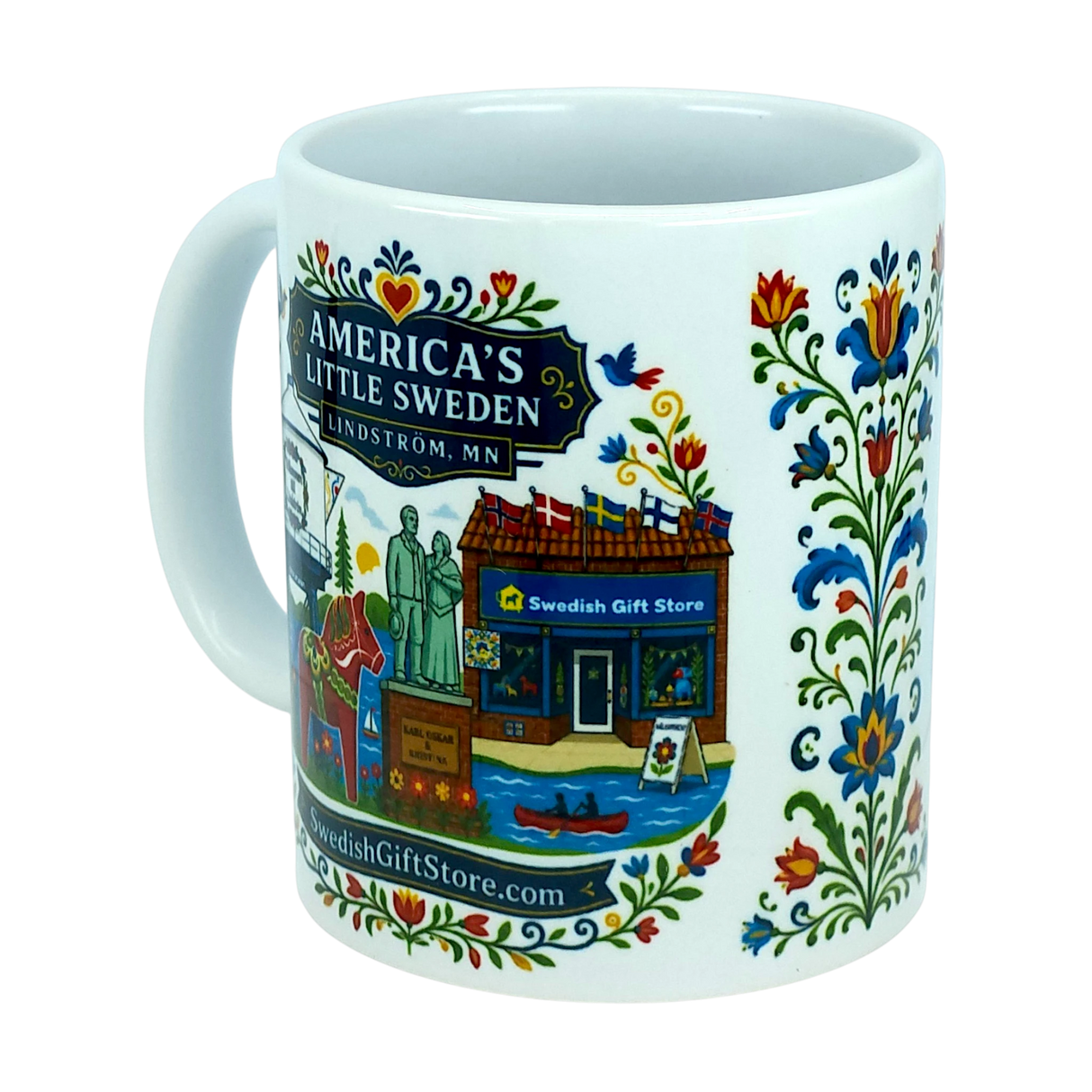 Introducing the Mug: Swedish Gift Store America's Little Sweden Ceramic Mug (11 oz) by Nordic Wholesale. This white ceramic mug showcases vibrant Swedish folk art, a storefront with the “Swedish Gift Store” sign, and a statue, along with text that reads “America’s Little Sweden, Lindström, MN.” The handle and right side are adorned with charming floral patterns and a cheerful Dala horse design for an authentic Nordic touch.