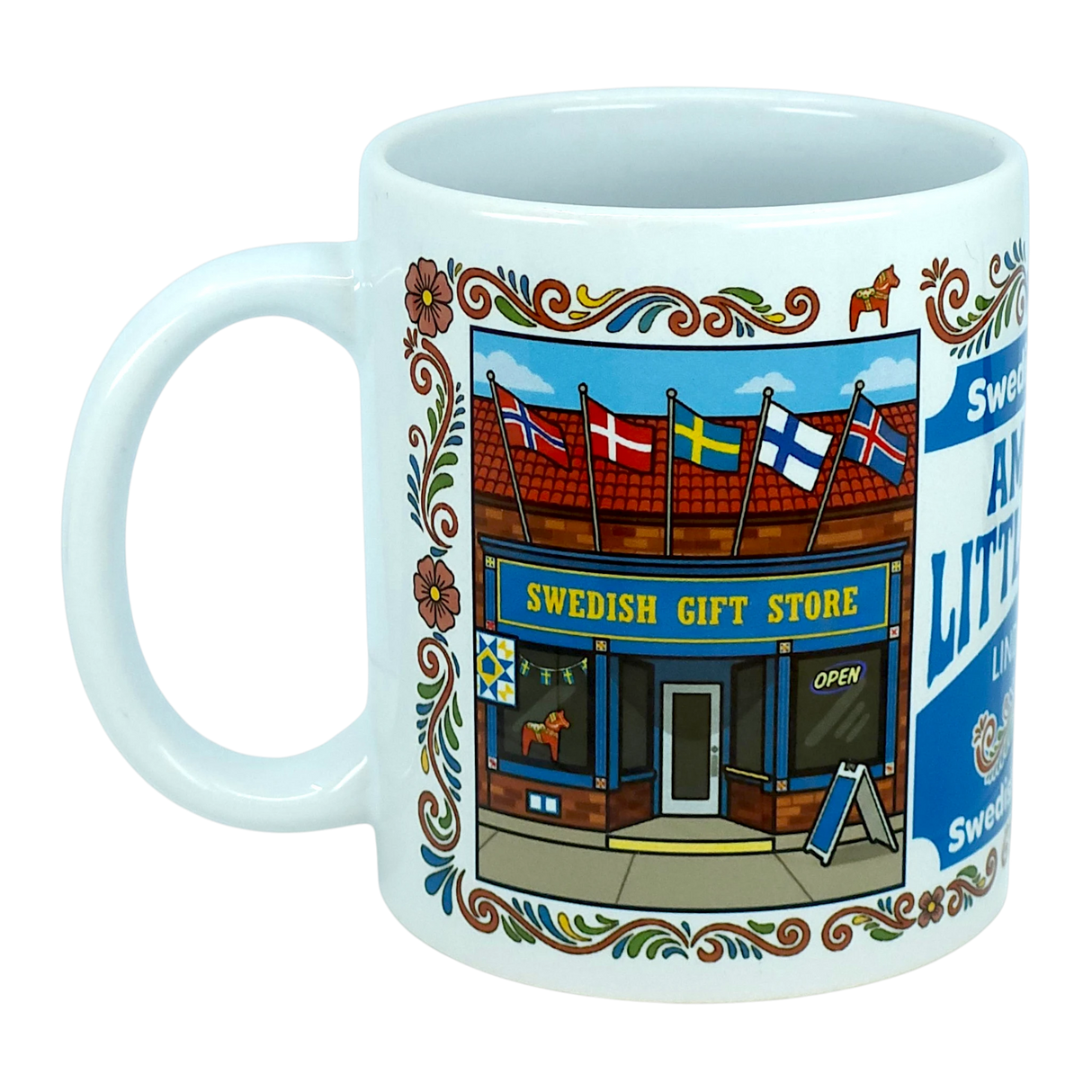 The Nordic Wholesale "Mug: Swedish Gift Store America's Little Sweden Wraparound Ceramic Mug" (11 oz) is a white ceramic mug adorned with an illustration of a Swedish gift store, complete with Scandinavian flags above the entrance and floral decorative borders along the edge.