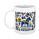 The Nordic Wholesalers Mug: Swedish Icons & Dala Horse Folk Art Ceramic Mug (11 oz) features a vibrant blue Dala horse, flowers, houses, and Swedish flags with "SWEDEN" printed below the design.