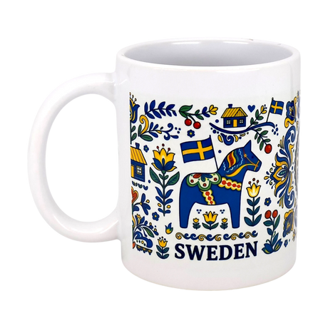 The Nordic Wholesale Mug: Swedish Icons & Dala Horse Folk Art Ceramic Mug (11 oz) features colorful folk art with a blue Dala horse, flowers, Swedish flags, houses, and "SWEDEN" in bold blue letters below the design.
