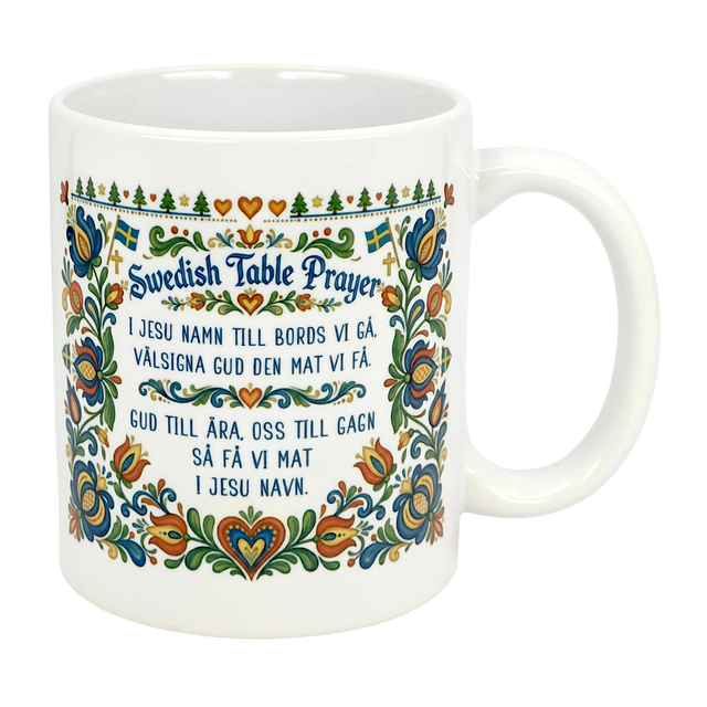 The Nordic Wholesale 11 oz Swedish Table Prayer Ceramic Kurbits Mug features colorful Swedish folk art, Kurbits floral design, small Swedish flags, and the Table Prayer printed in both Swedish and English at the center.