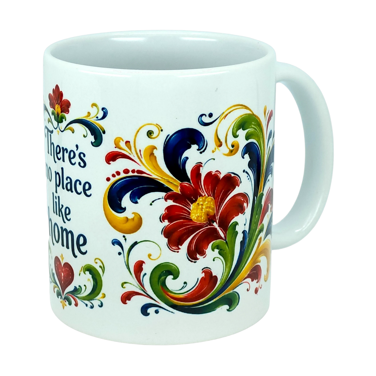 Introducing the Mug: There's No Place Like Home Rosemaling Ceramic Mug (11 oz) by Nordic Wholesale—a white ceramic coffee mug adorned with vibrant red, yellow, green, and blue floral motifs and scrolling patterns inspired by Scandinavian folk art. Part of the design includes the phrase "There's no place like home," while the handle remains plain.