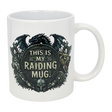 The Nordic Wholesale Mug: This Is My Raiding Mug Viking Ceramic Mug (11 oz) is a white ceramic mug with a dragon, wolf, and bear around a shield reading "This Is My Raiding Mug," surrounded by Norse and Viking-style designs.