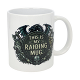 The Nordic Wholesale 11 oz ceramic mug features a fantasy Viking design with a dragon, wolf, bear, medieval weapons, and helmets around a shield reading "This Is My Raiding Mug.