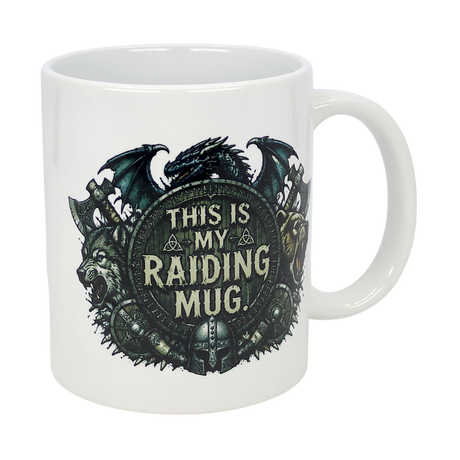 The Nordic Wholesale 11 oz ceramic mug features a fantasy Viking design with a dragon, wolf, bear, medieval weapons, and helmets around a shield reading "This Is My Raiding Mug.