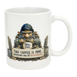 The Mug: Troll Fuel Ceramic Coffee Mug (11 oz) by Nordic Wholesale features a cartoon troll in a blue hat with a "TROLL FUEL" sign and bold warning: THIS COFFEE IS MINE. TRESPASSERS WILL BE DECAFFEINATED, plus decorative stones and Nordic folklore symbols.