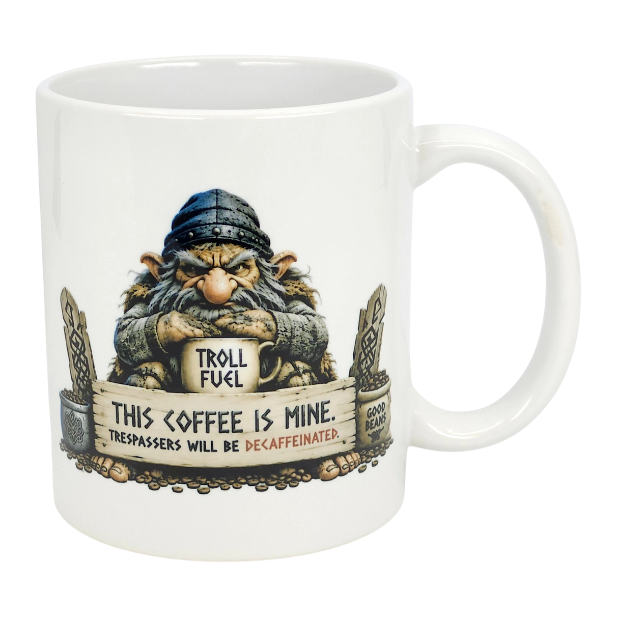 The Mug: Troll Fuel Ceramic Coffee Mug (11 oz) by Nordic Wholesale features a cartoon troll in a blue hat with a "TROLL FUEL" sign and bold warning: THIS COFFEE IS MINE. TRESPASSERS WILL BE DECAFFEINATED, plus decorative stones and Nordic folklore symbols.