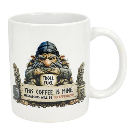 The Mug: Troll Fuel Ceramic Coffee Mug (11 oz) by Nordic Wholesale features a cartoon troll in a blue hat with a "TROLL FUEL" sign and bold warning: THIS COFFEE IS MINE. TRESPASSERS WILL BE DECAFFEINATED, plus decorative stones and Nordic folklore symbols.